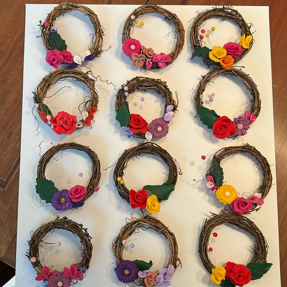 4” grapevine wreath decorated with handmade clay flowers
